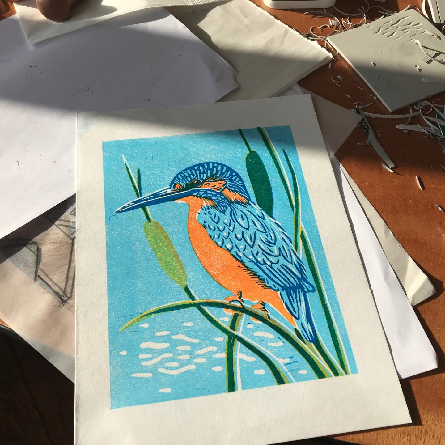 A Barle river kingfisher captured in linocut at Knapp House creative Luna North course